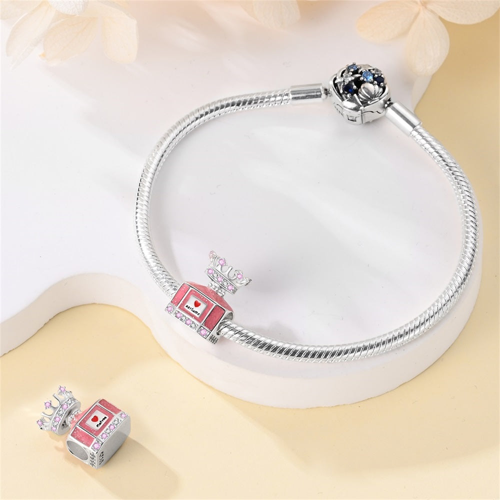 Ružový parfum s korunkou